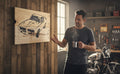 TK Wood Designs GTO car illustration on salvaged wood with black ink and natural wood grain.