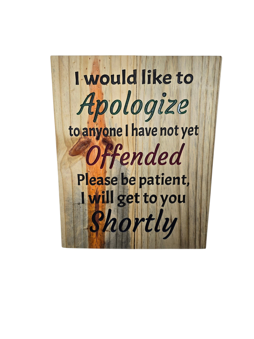 TK Wood Designs humorous wall art with "I would like to apologize to anyone I have not yet offended. Please be patient, I will get to you shortly" text on a wood-like background.