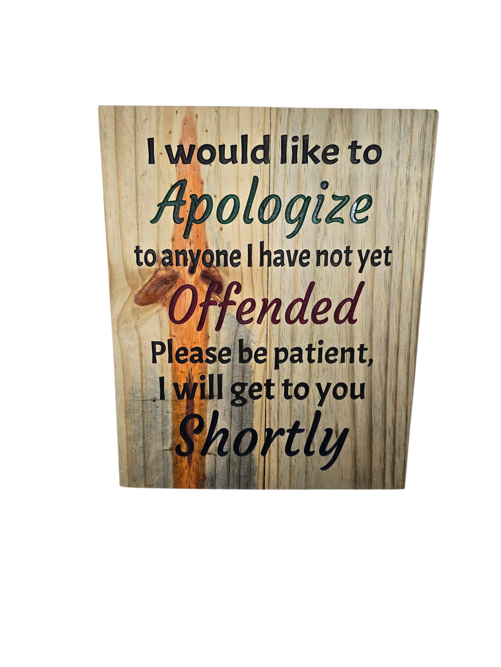 TK Wood Designs humorous wall art with wood-like background and black, green, and red text.