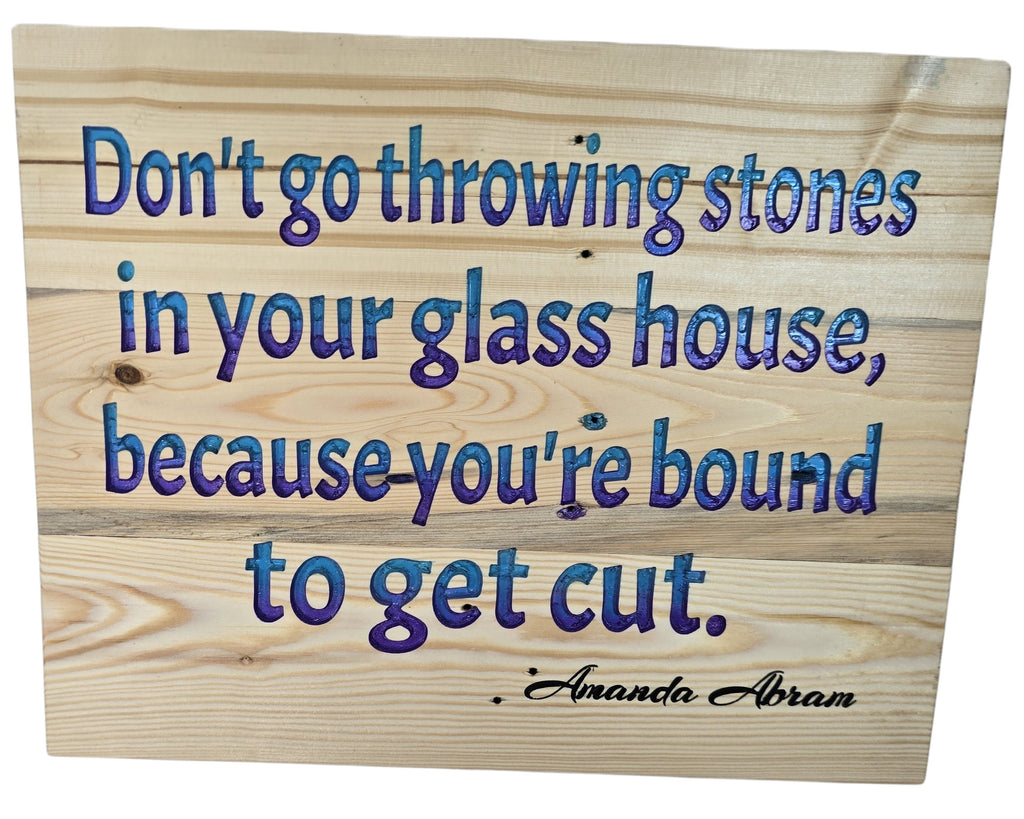 TK Wood Designs inspirational wood wall art with blue and purple quote 'Don't go throwing stones in your glass house, because you're bound to get cut.'