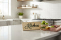 TK Wood Designs natural wood kitchen sign with dark green script lettering. Rustic home decor.
