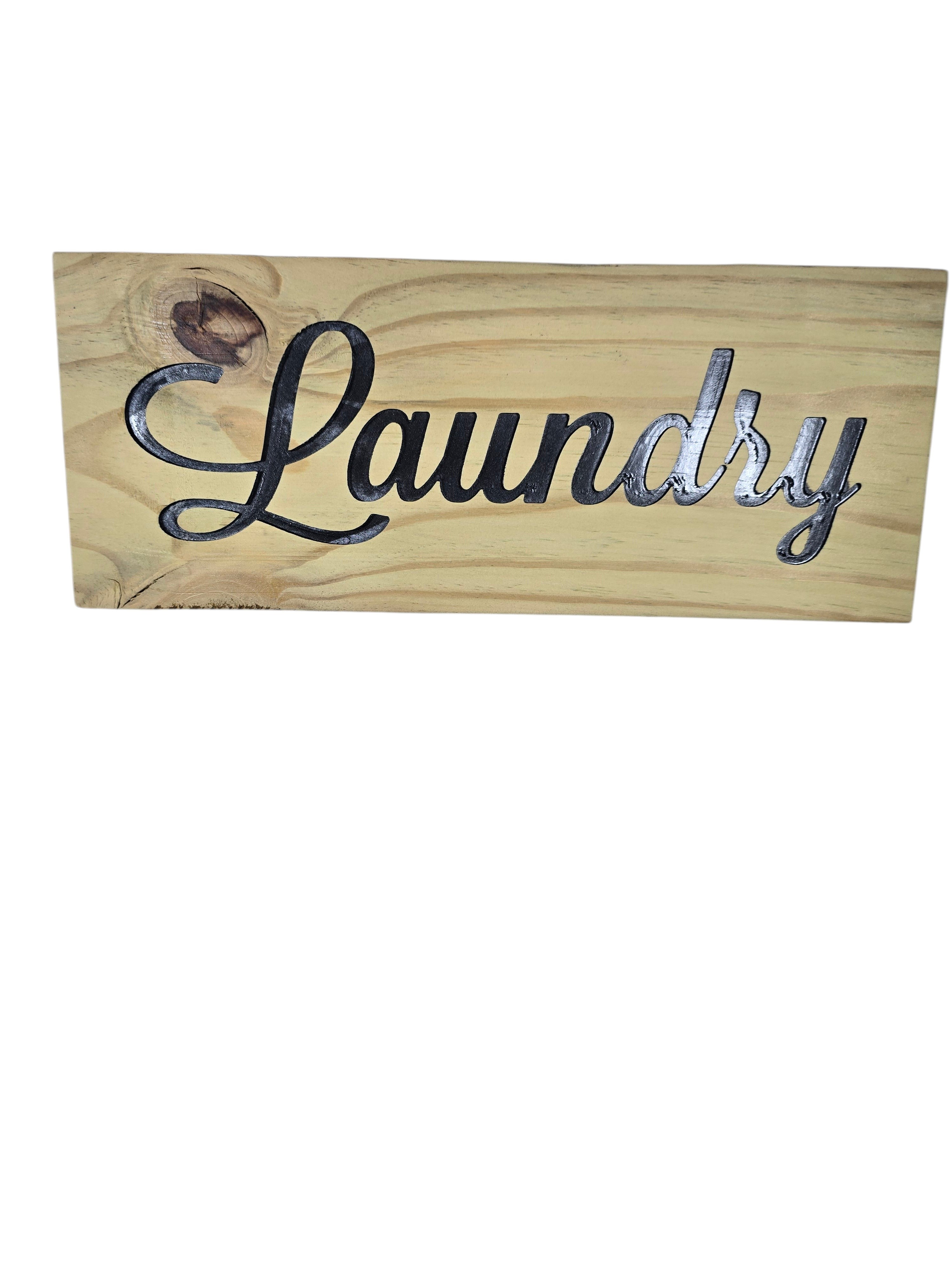 TK Wood Designs rustic light wood sign with carved black script 'Laundry'.