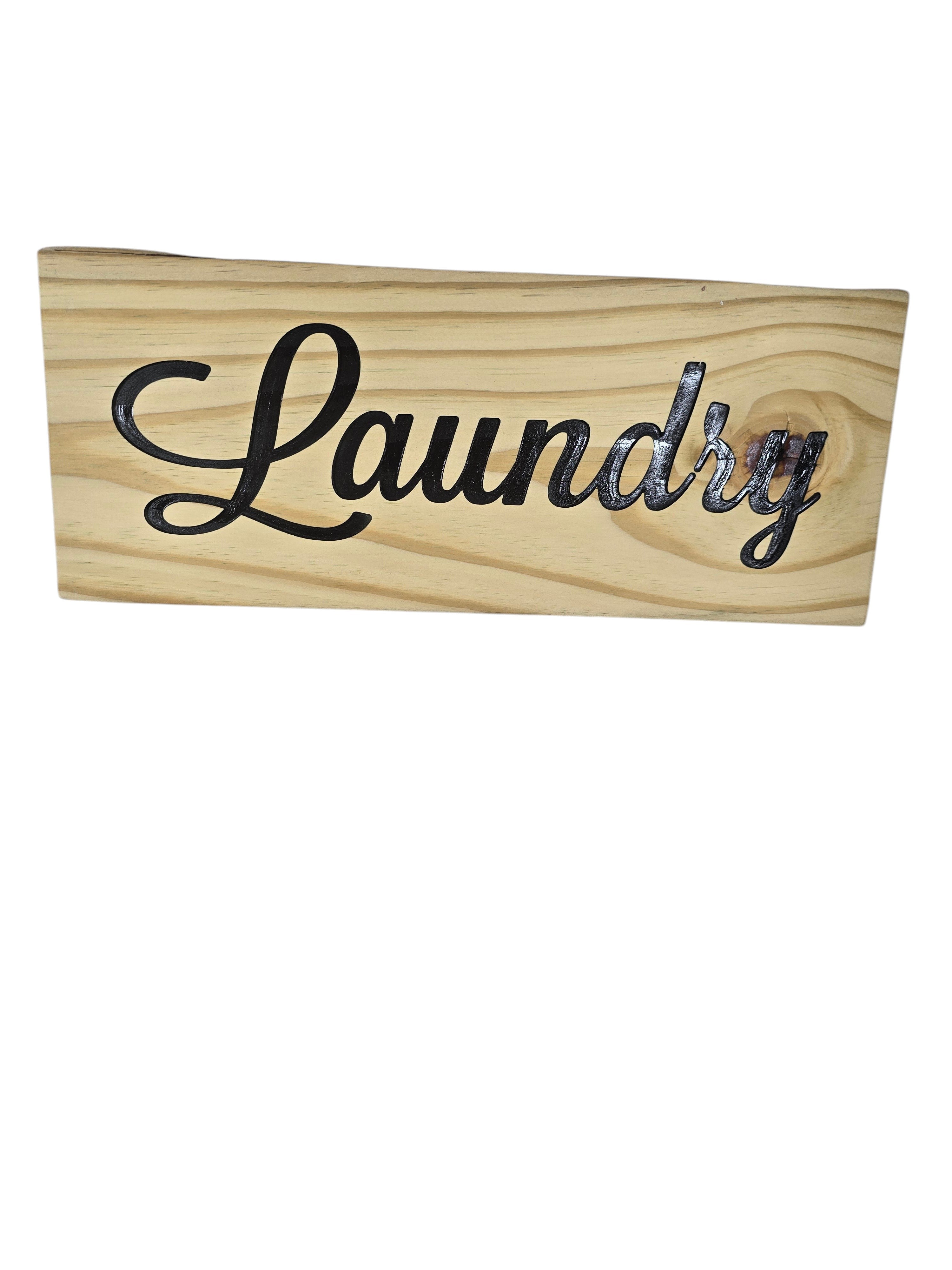 TK Wood Designs rustic wooden laundry sign with black script lettering.