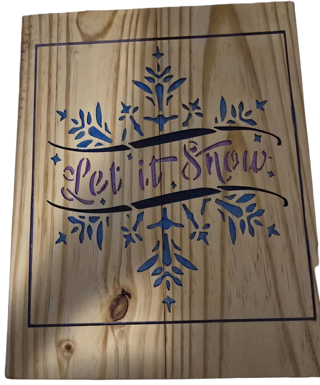TK Wood Designs rustic wood sign with "Let it Snow" text and blue & purple snowflake design. Natural wood grain.