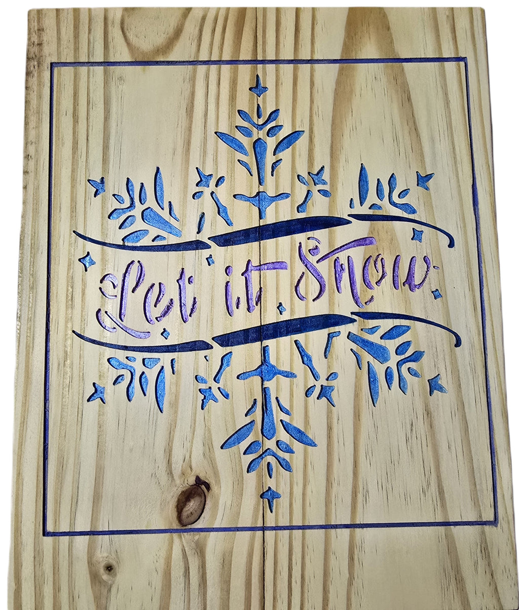 TK Wood Designs rustic wood sign with "Let it Snow" carved and painted in blue and purple, featuring a snowflake motif.