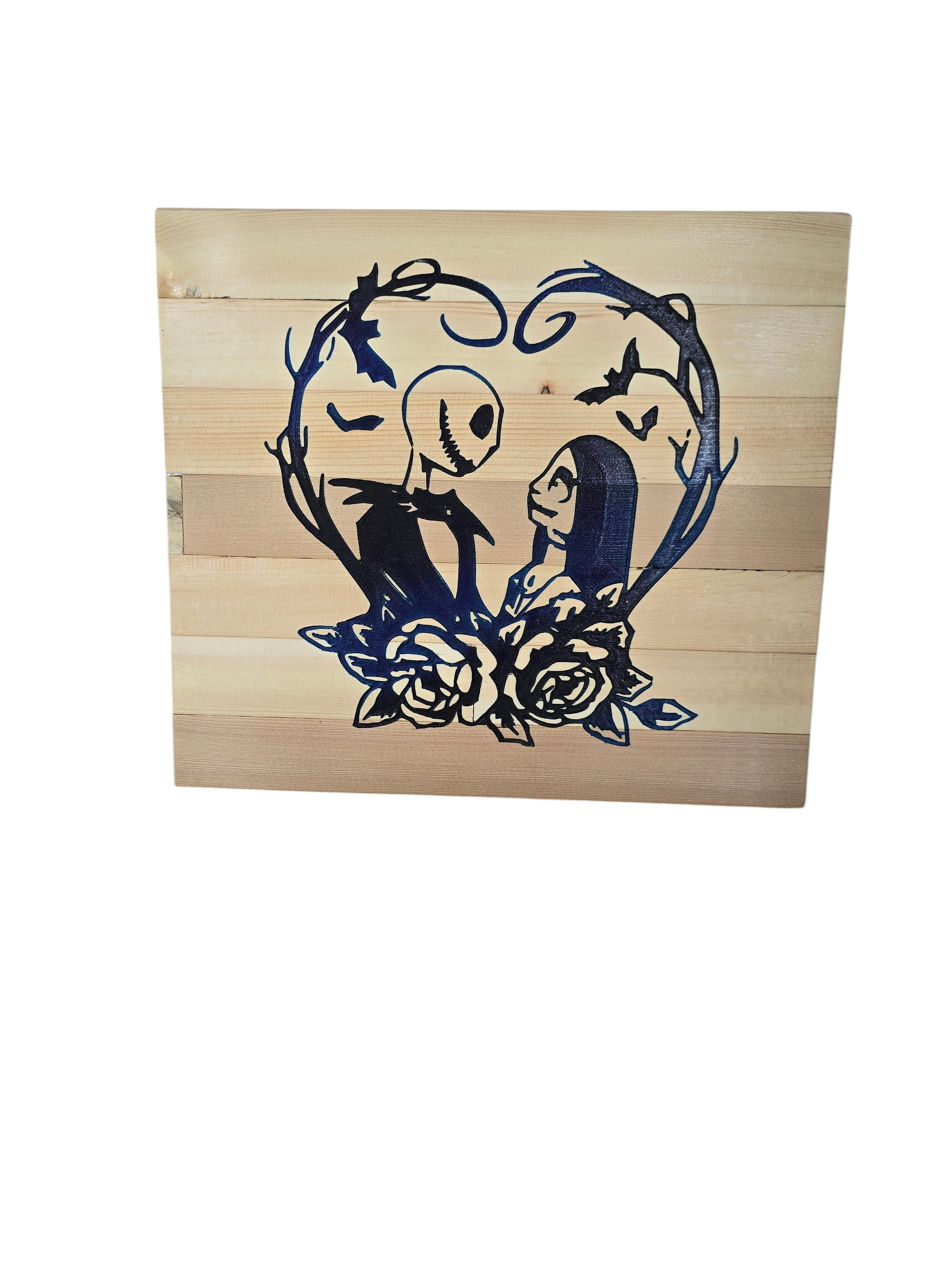 TK Wood Designs Nightmare Before Christmas heart art with Jack and Sally silhouettes, roses, and bats on wood planks.