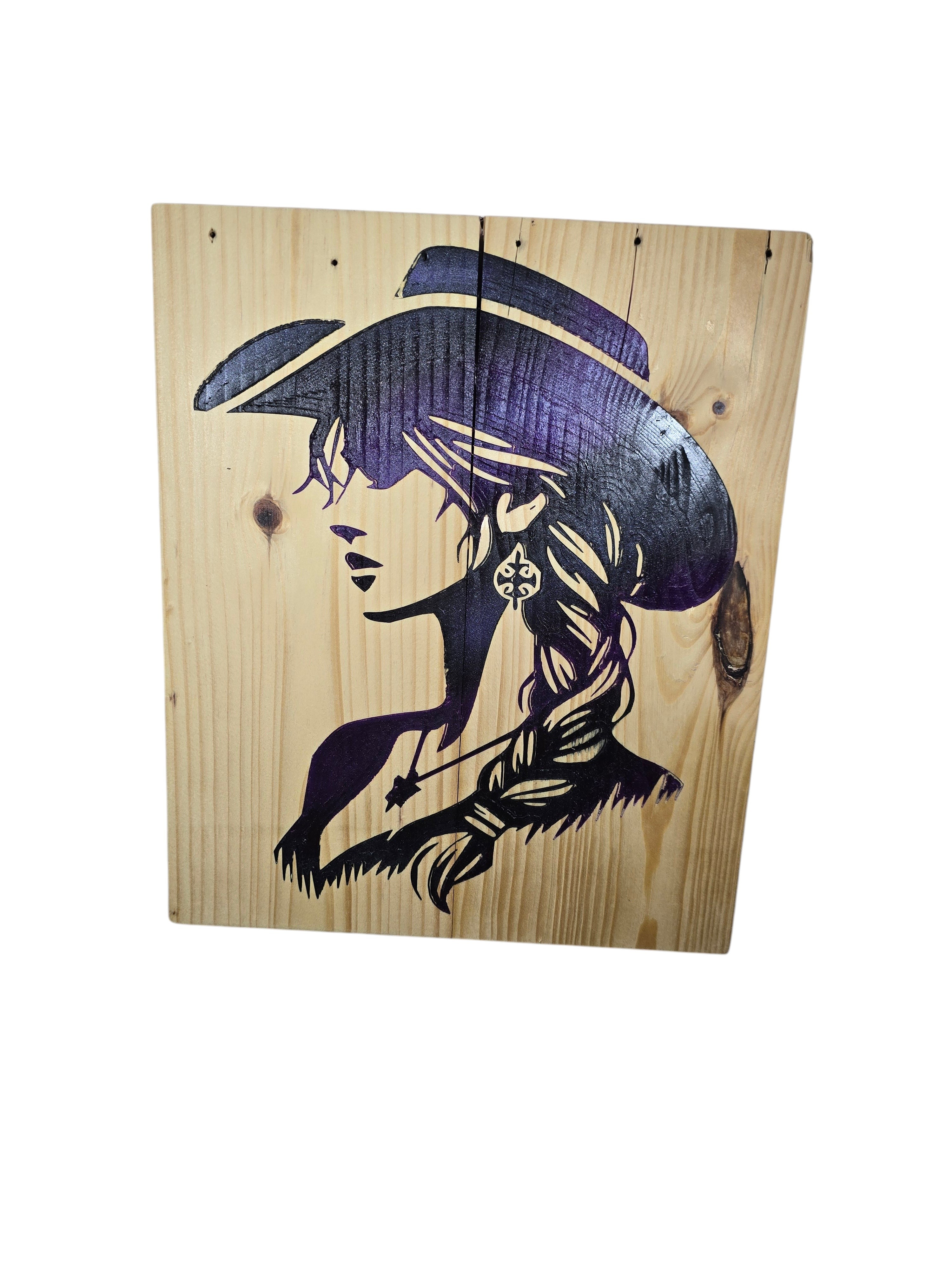 TK Wood Designs purple and black cowgirl silhouette on a rustic wood sign. Features braided hair and a cowboy hat.