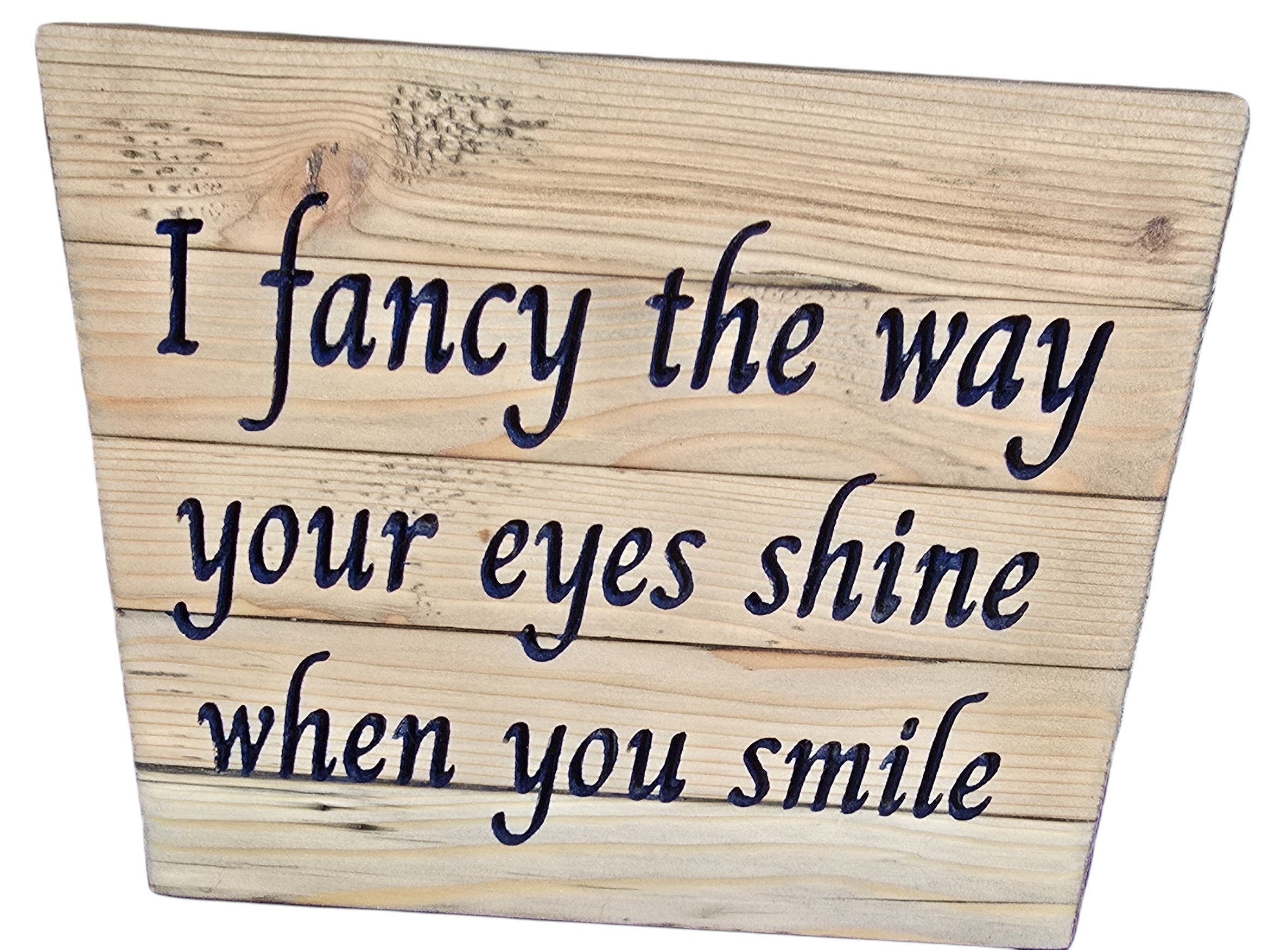 TK Wood Designs reclaimed wood sign with carved text 'I fancy the way your eyes shine when you smile'. Rustic, natural wood finish.