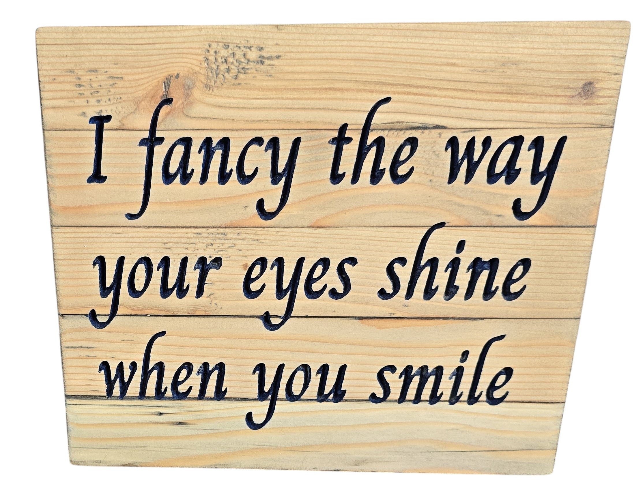 TK Wood Designs reclaimed wood sign with carved text 'I fancy the way your eyes shine when you smile'. Rustic, natural wood finish.