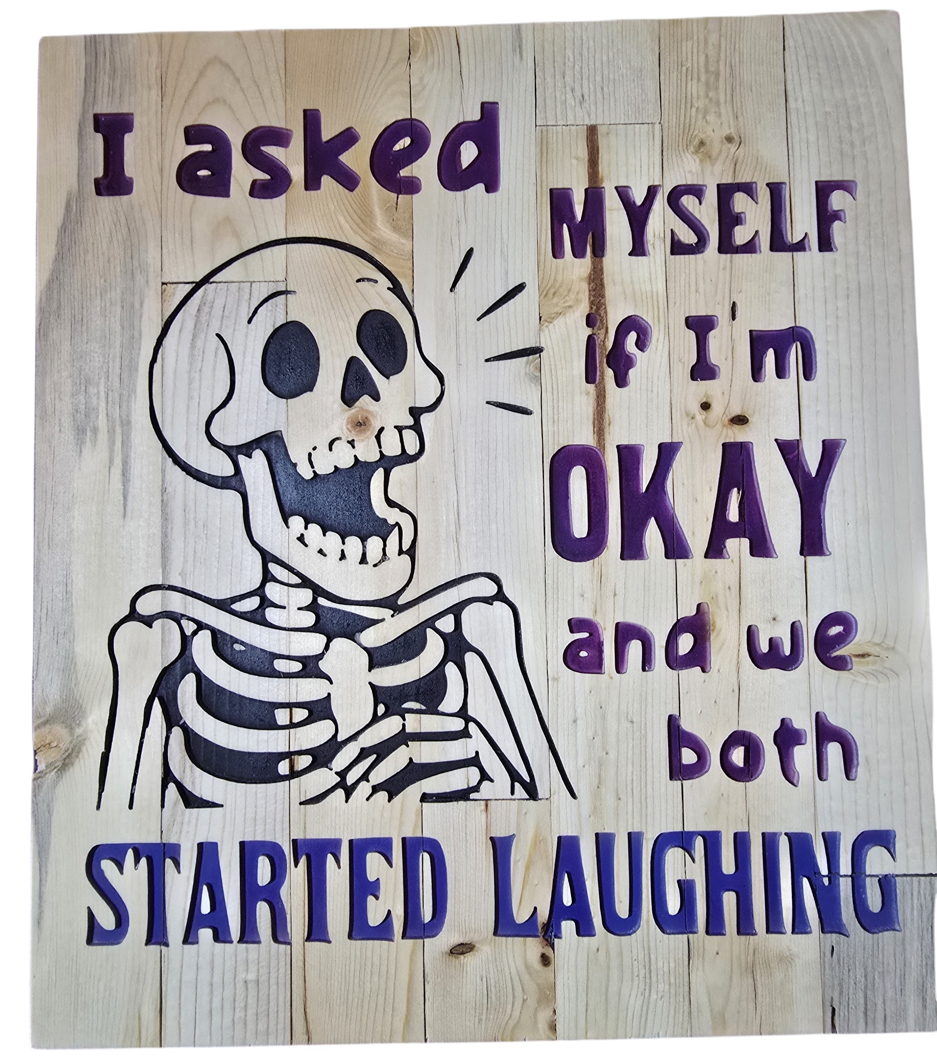 TK Wood Designs reclaimed wood sign with a skeleton graphic and purple text that reads "I asked MYSELF if I'm OKAY and we both STARTED LAUGHING."