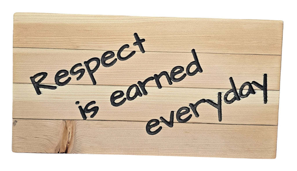 TK Wood Designs wooden sign with black text reading "Respect is earned everyday".
