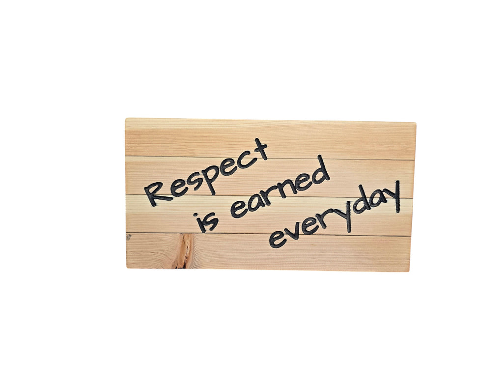 TK Wood Designs wooden sign with black hand-painted text reading "Respect is earned everyday".