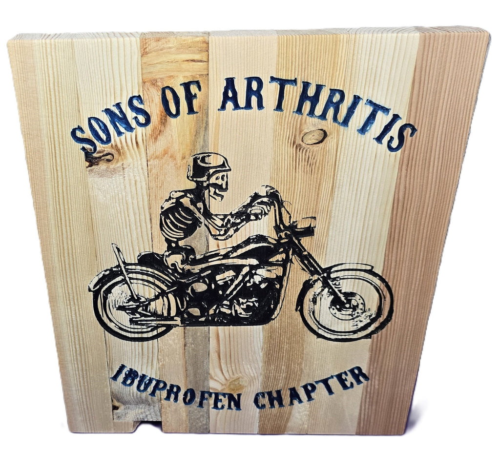 TK Wood Designs wooden sign with skeleton biker and "Sons of Arthritis Ibuprofen Chapter" text. Rustic wood art.