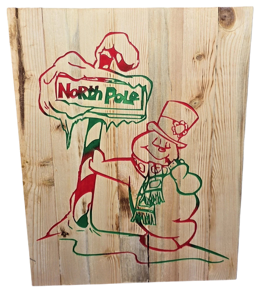 TK Wood Designs handmade rustic reclaimed wood sign with hand-painted snowman and North Pole sign in red and green.