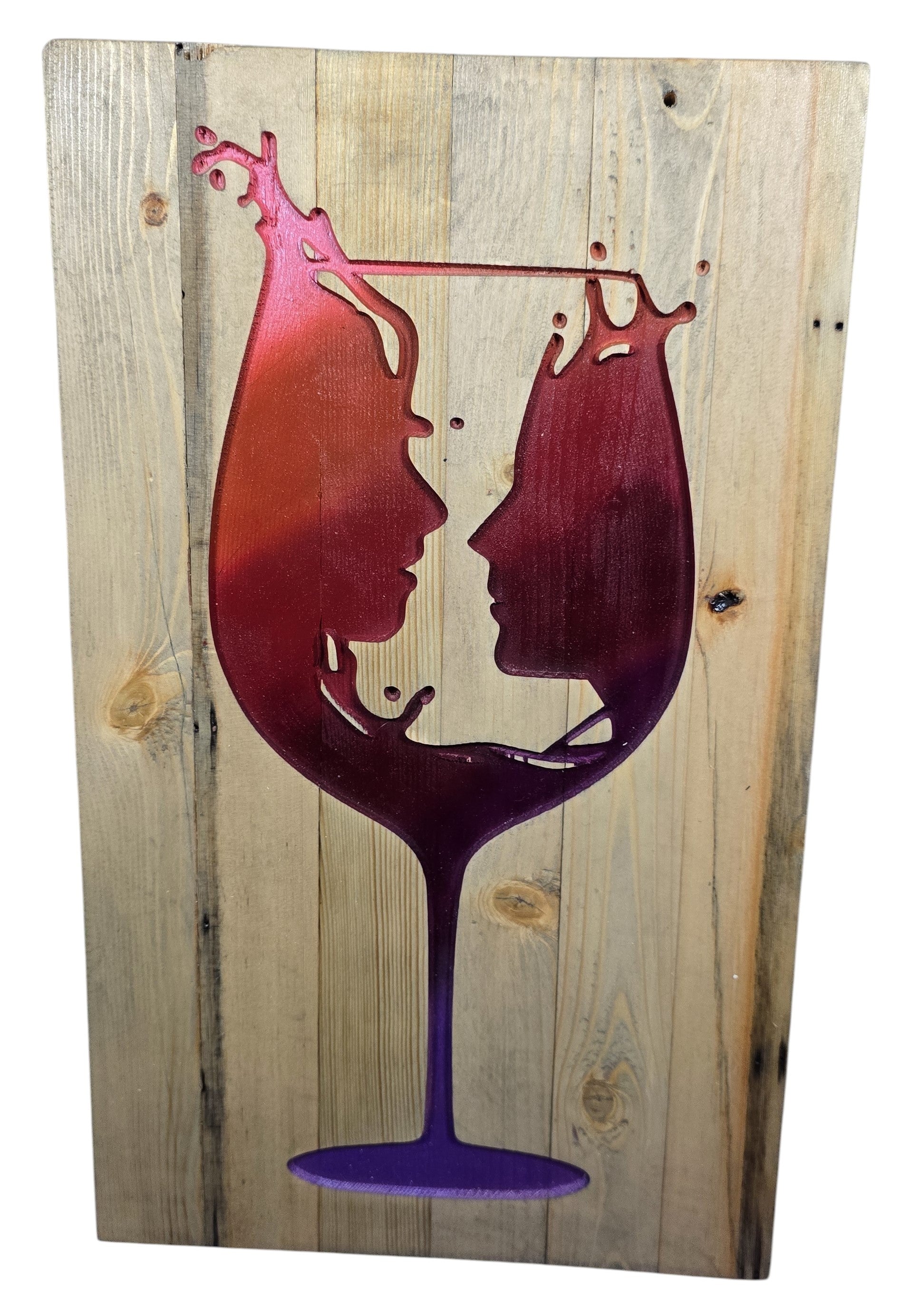 TK Wood Designs rustic wood wall art featuring a wine glass silhouette with two profiles facing each other, in gradient red and purple.