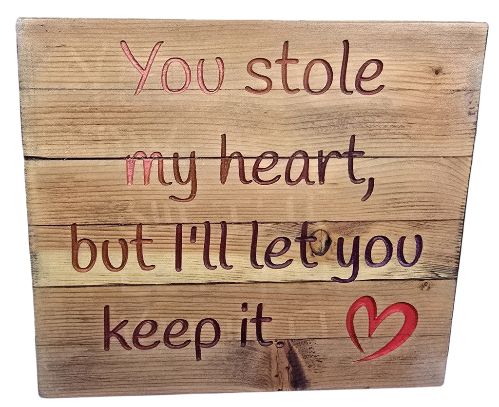 TK Wood Designs rustic wooden sign with carved lettering saying "You stole my heart, but I'll let you keep it" and a red heart accent.